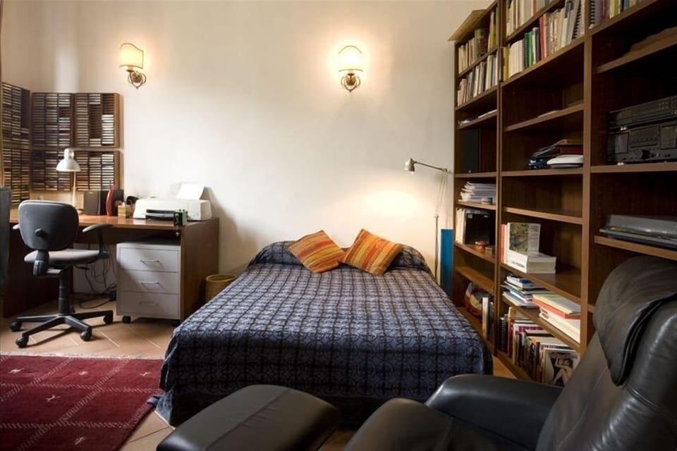 Study/bedroom with sofa bed pulled out.