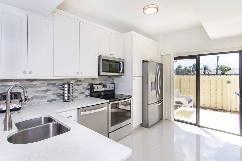 new cabinets kitchen opens to private deck