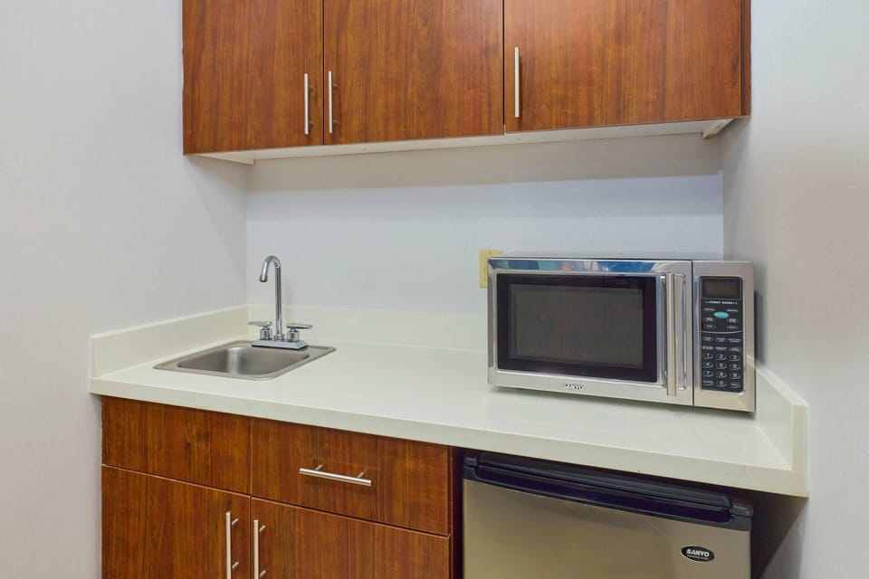 Studio Suite, 1 King Bed with Sofa bed, Non Smoking (Upper Floor) | Desk, laptop workspace, blackout drapes, iron/ironing board