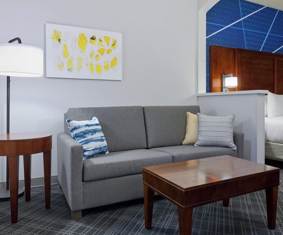 Desk, laptop workspace, blackout drapes, iron/ironing board