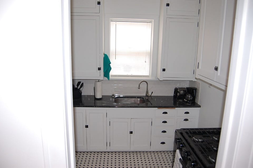 Original cabinets but updated granite counters and new full size appliances