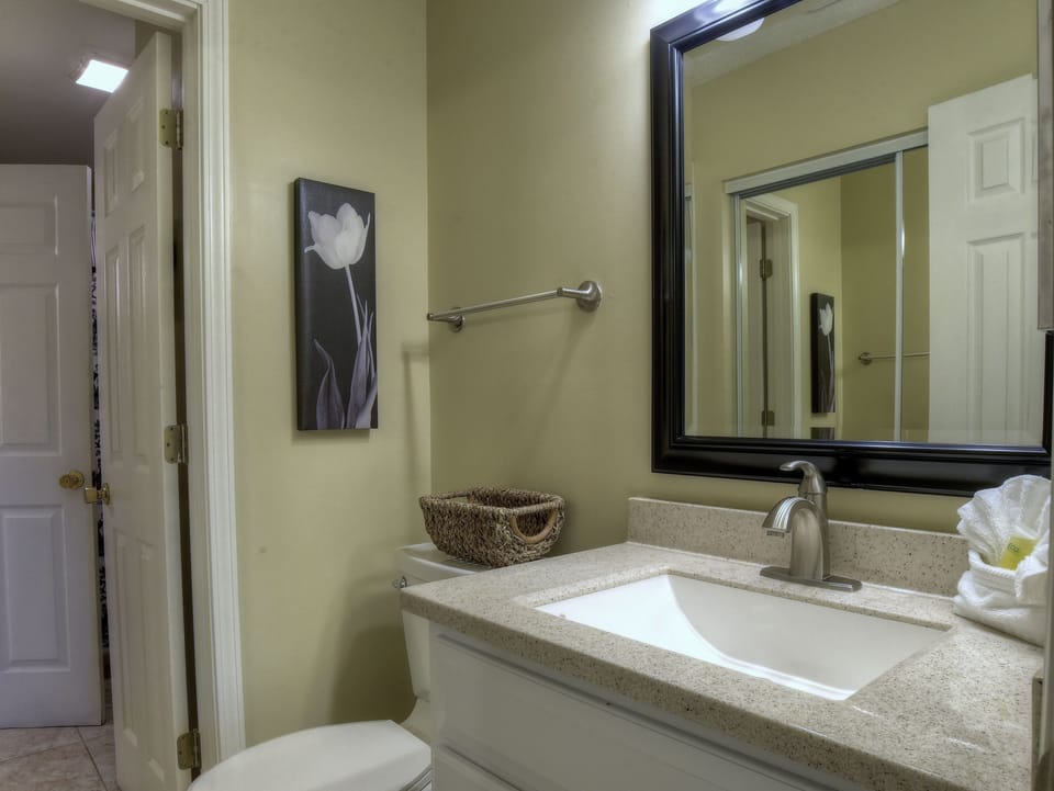 Door leads into shower/laundry room from master bedroom's half bath