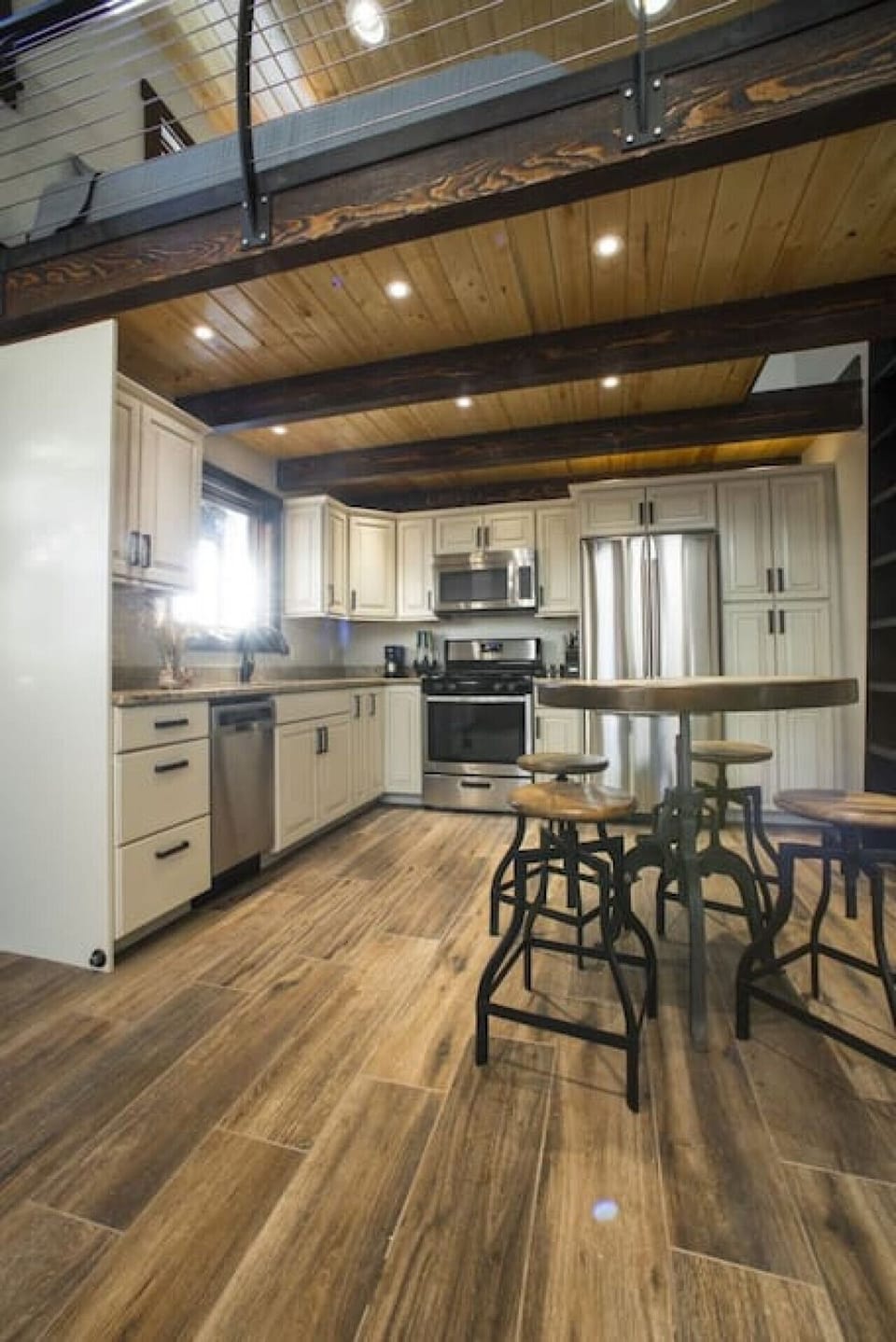 Kitchen with granite, stainless appliances & 100% LED throughout.