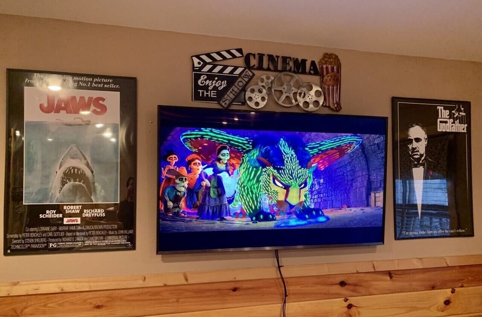Big screen TV in downstairs movie/game room area