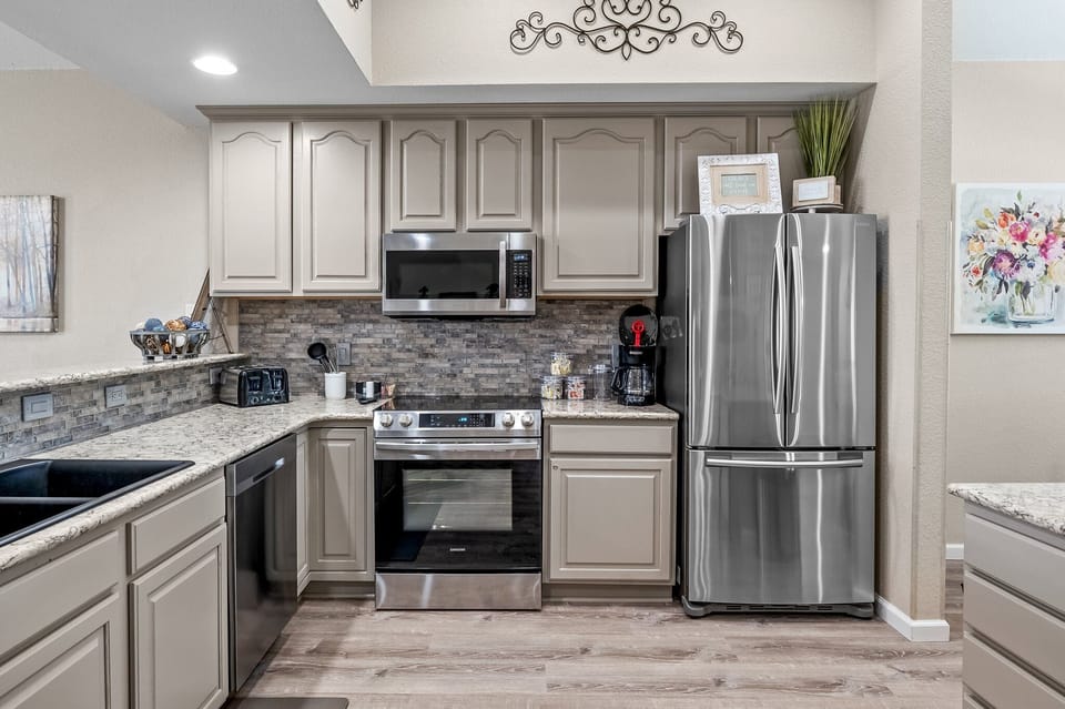 Kitchen with stainless steel appliances.