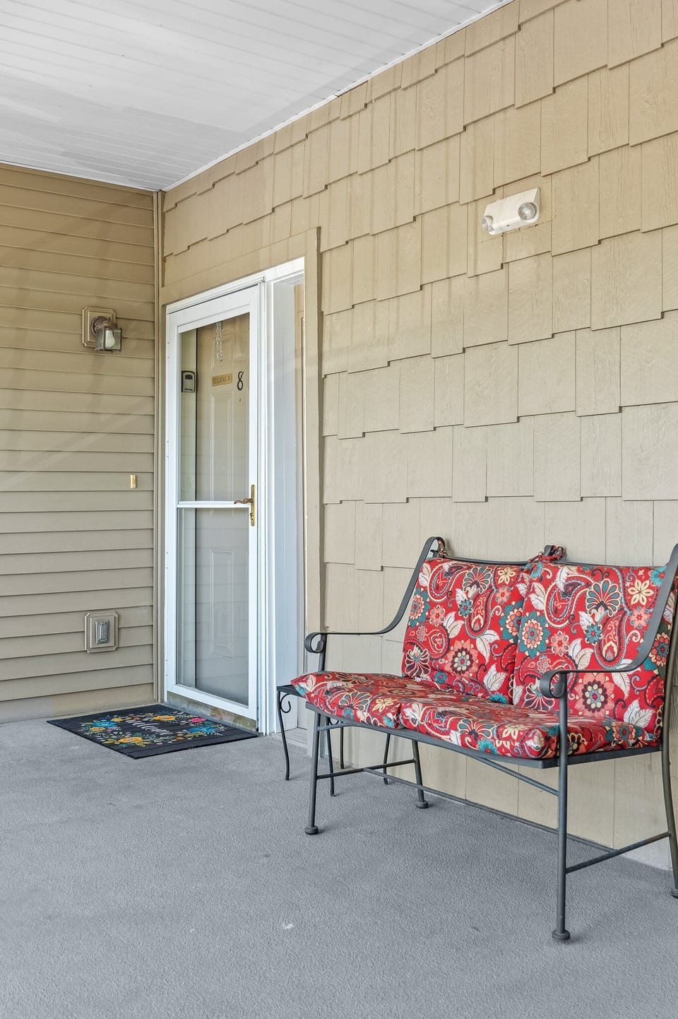 Entry to our condo with outdoor seating to enjoy the weather