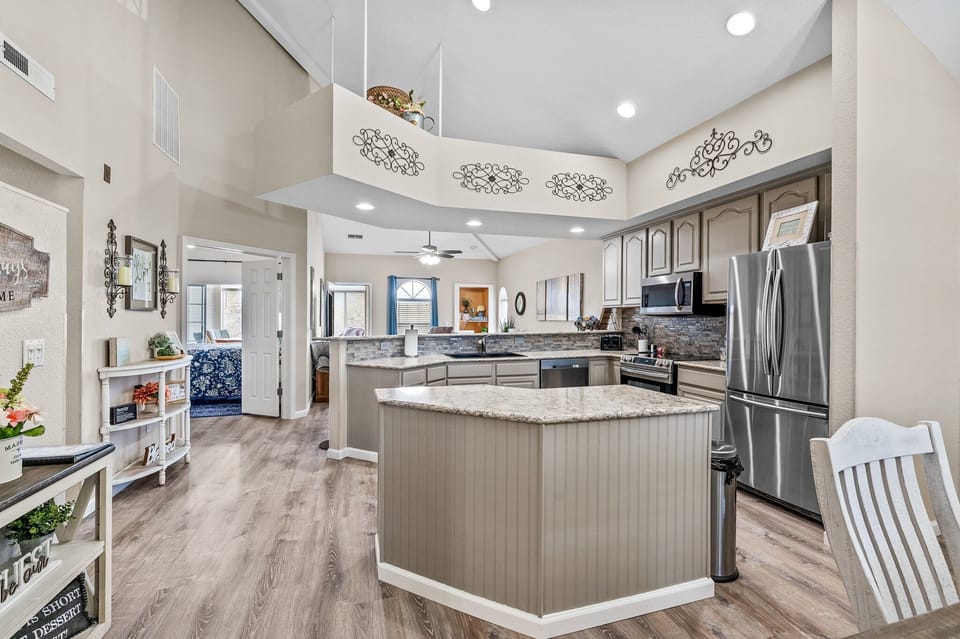 Main floor with open concept with dining, kitchen and living room