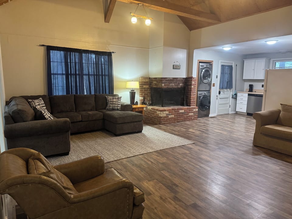 Open concept living room and kitchen. Wood burning fireplace. Washer/dryer