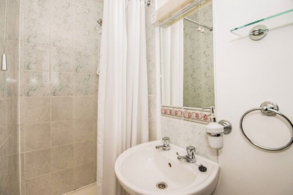 Shower, rainfall showerhead, hair dryer, towels