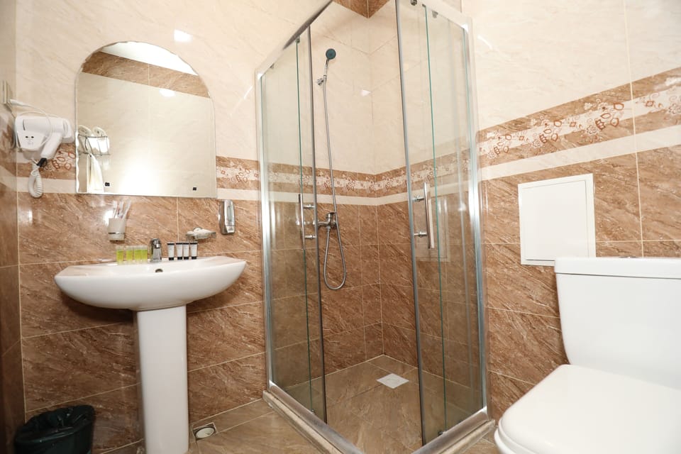 Shower, free toiletries, hair dryer, slippers