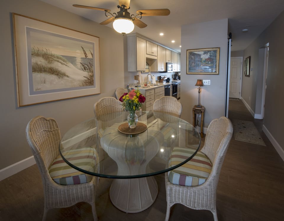 Dining table with new kitchen just beyond