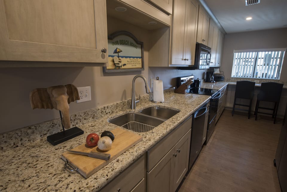 New everything in kitchen, including wrap-around bar tabletop in background