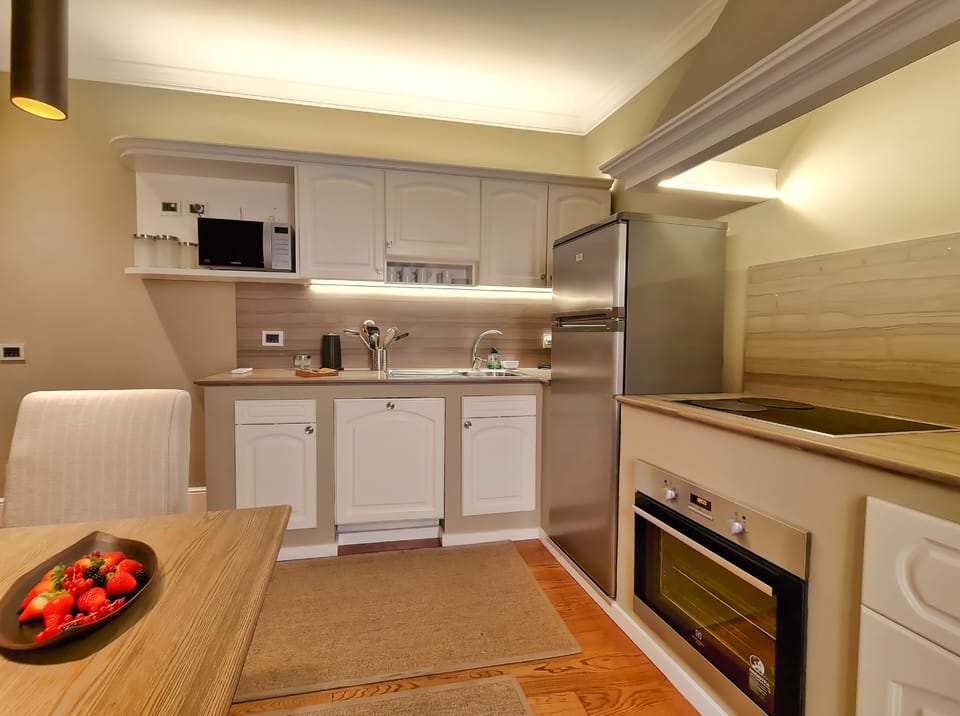 Deluxe Apartment - annex building | Living area | 32-inch LCD TV with satellite channels