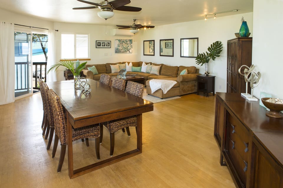 large dinning room table with seating for 8, with ocean views 
