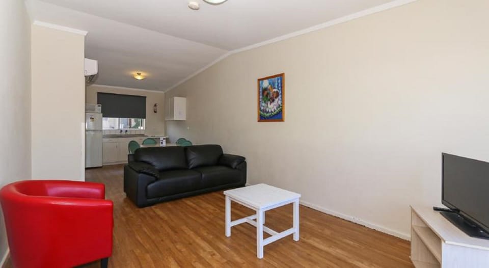 Basic Apartment, 2 Bedrooms | Living area | 40-inch flat-screen TV with digital channels, TV