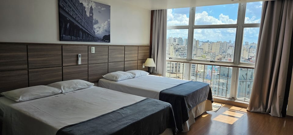 Standard Room | Minibar, in-room safe, blackout drapes, iron/ironing board