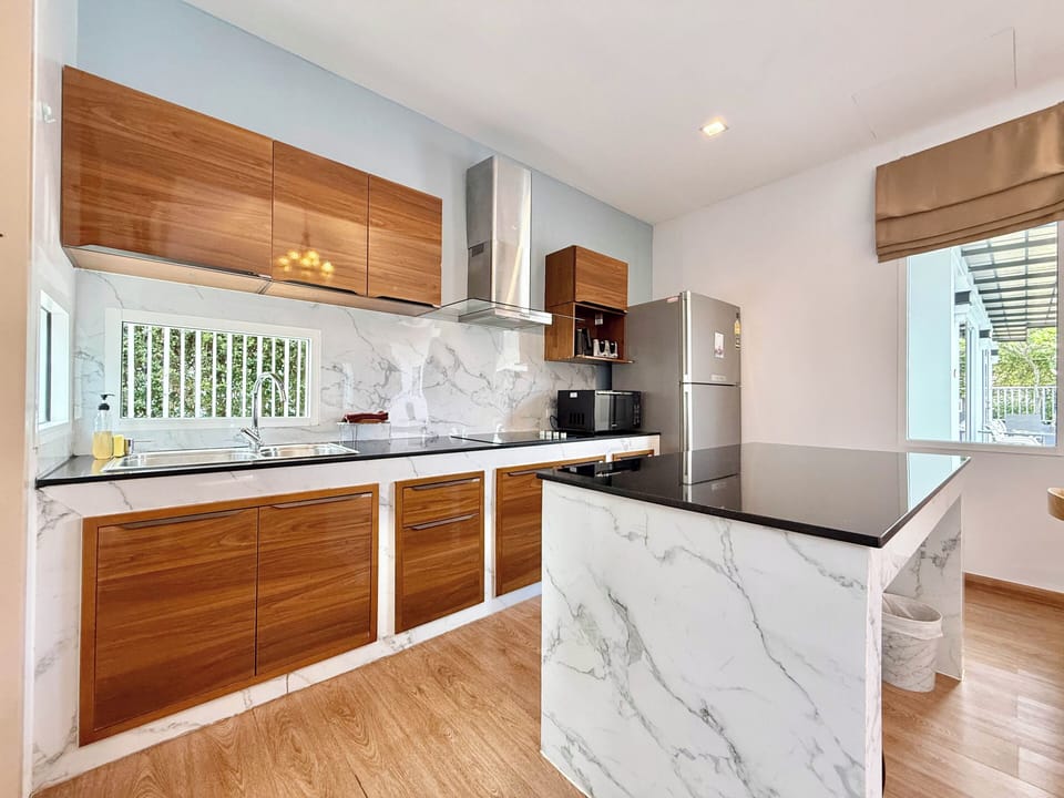 One Bedroom Suite Pool Access | Private kitchen | Full-size fridge, shared microwave, dishwasher, electric kettle