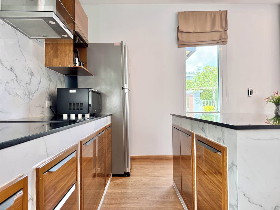 One Bedroom Suite Pool Access | Private kitchen | Full-size fridge, shared microwave, dishwasher, electric kettle