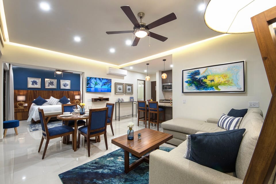 Living room with air conditioning and fan, dining table and Android TV
