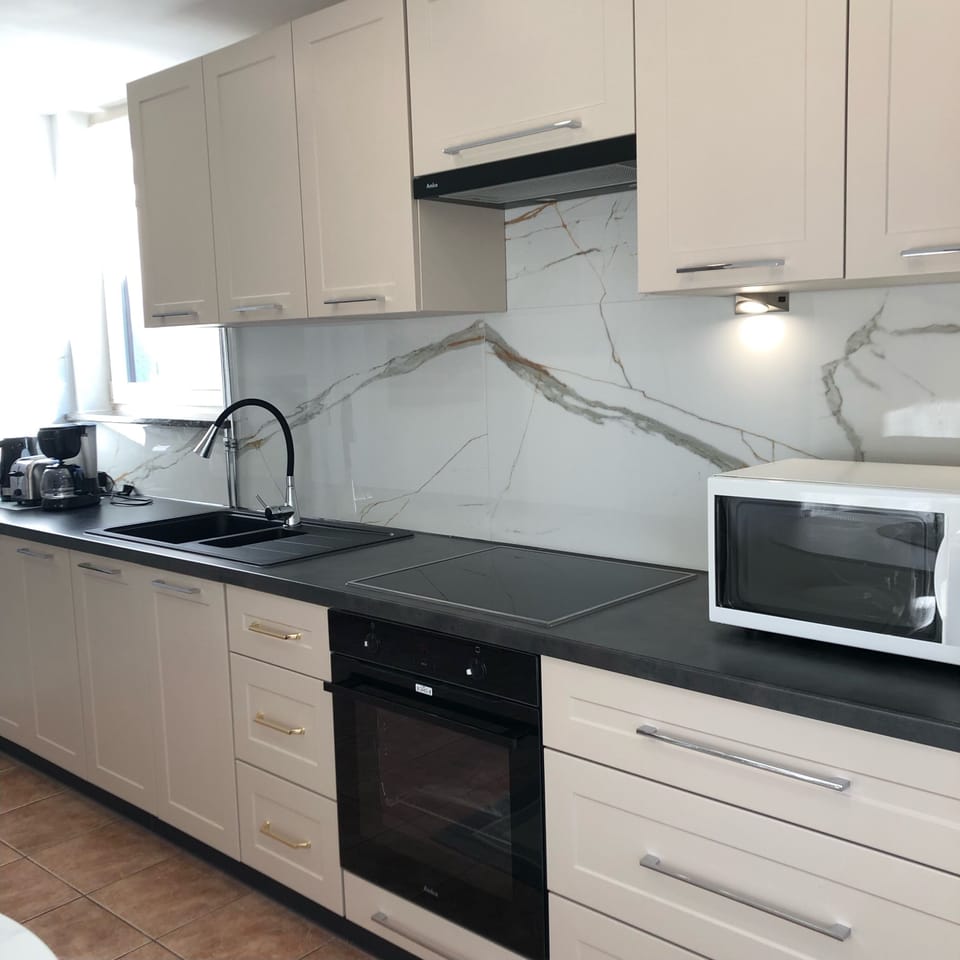 Comfort Apartment | Private kitchen | Coffee/tea maker, electric kettle, cookware/dishes/utensils