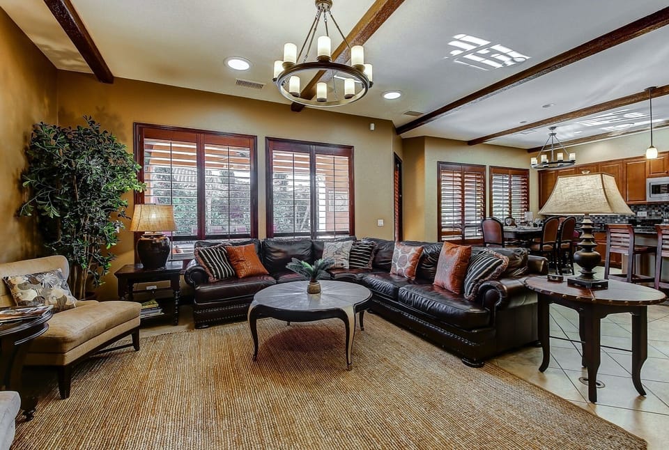 The living room is massive and open with a cabinet full of board games for the kids.