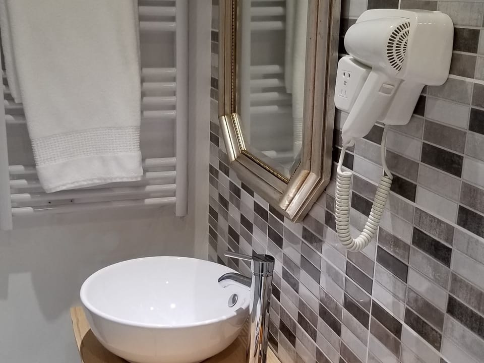 Deep soaking tub, rainfall showerhead, free toiletries, hair dryer