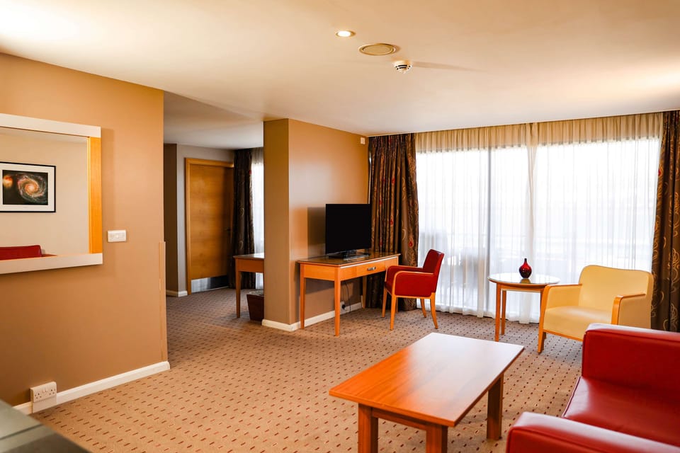 Junior Suite, 1 King Bed (Daytime Pitch View) | Living area | 55-inch LCD TV with satellite channels