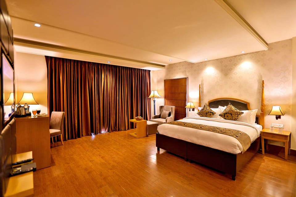 Executive Suite with Private Balcony | In-room safe, desk, laptop workspace, iron/ironing board