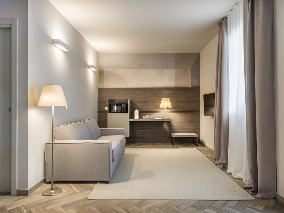 Family Suite, 1 Queen Bed with Sofa bed, Balcony, Lake View | Living area | TV