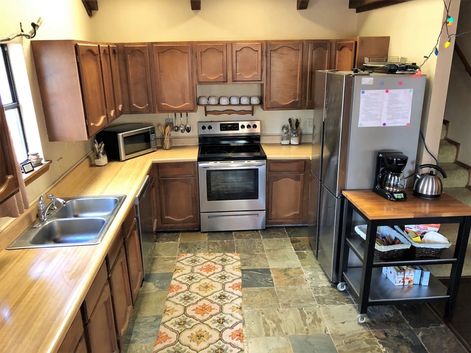 Kitchen new stainless steel stove and refrigerator