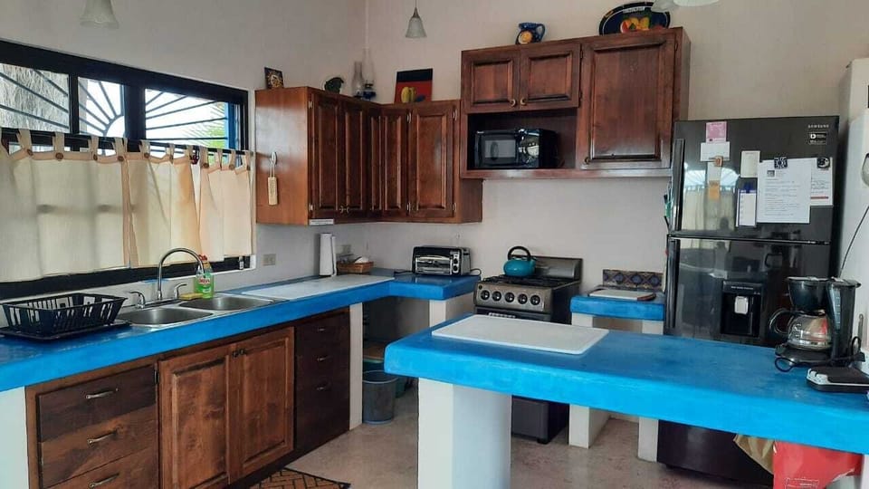 Kitchen complete with microwave down to margarita glasses and French press!
