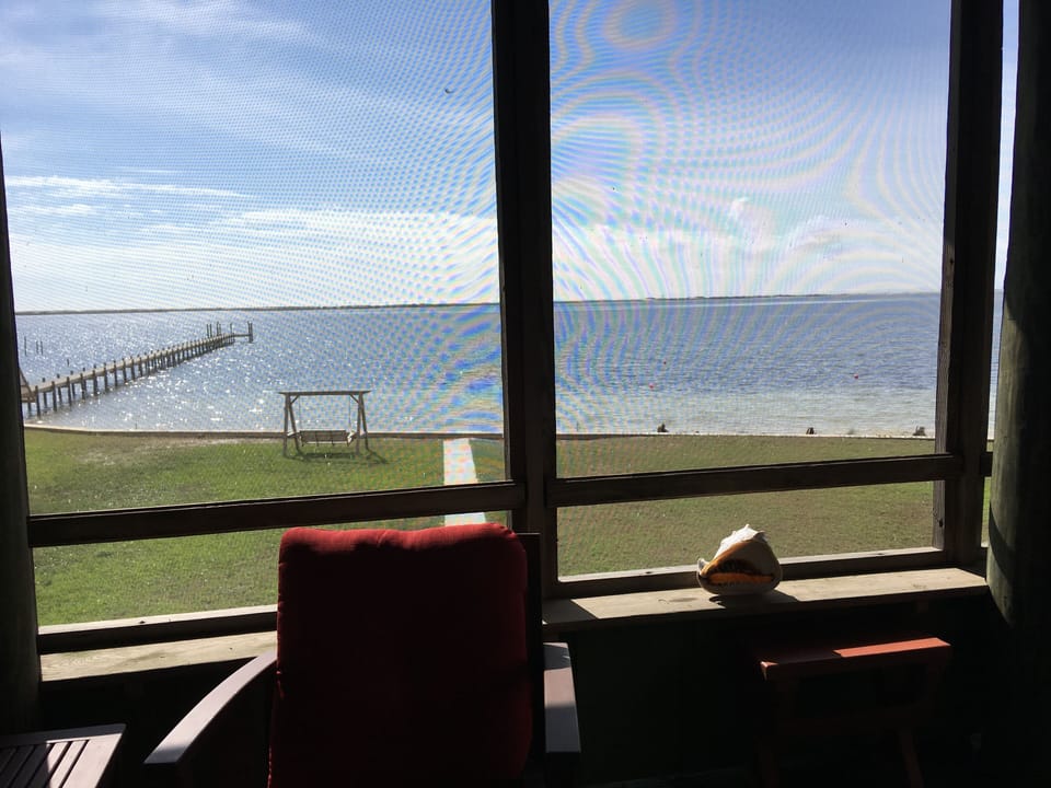 Front 500 sq ft screened porch (pier is not part of the property)