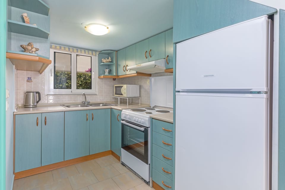 Superior Apartment, Sea View, Ground Floor | Private kitchen | Full-size fridge, coffee/tea maker, cookware/dishes/utensils