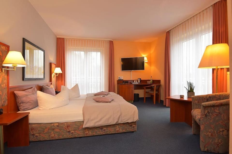 Minibar, desk, blackout drapes, bed sheets