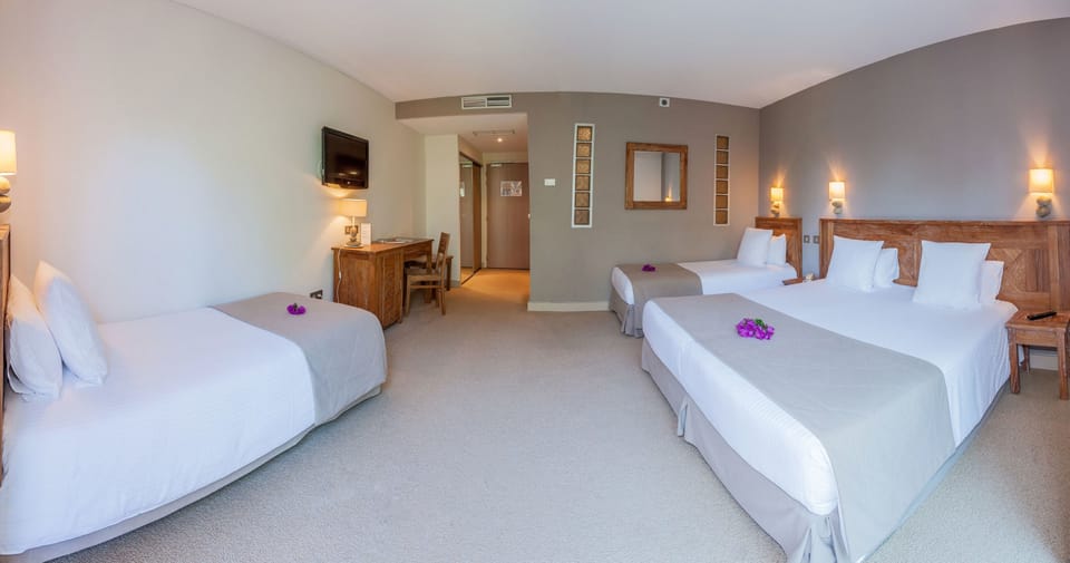 Standard Quadruple Room | In-room safe, desk, soundproofing, iron/ironing board