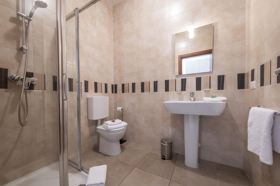 Shower, free toiletries, hair dryer, towels