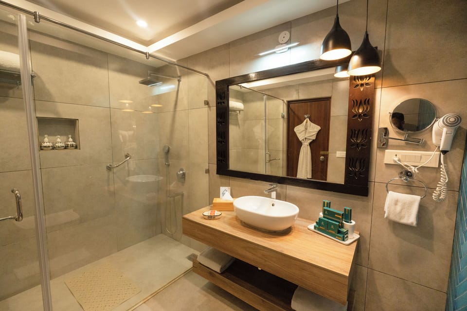 Family Room- Partial River View | Bathroom | Rainfall showerhead, free toiletries, hair dryer, towels