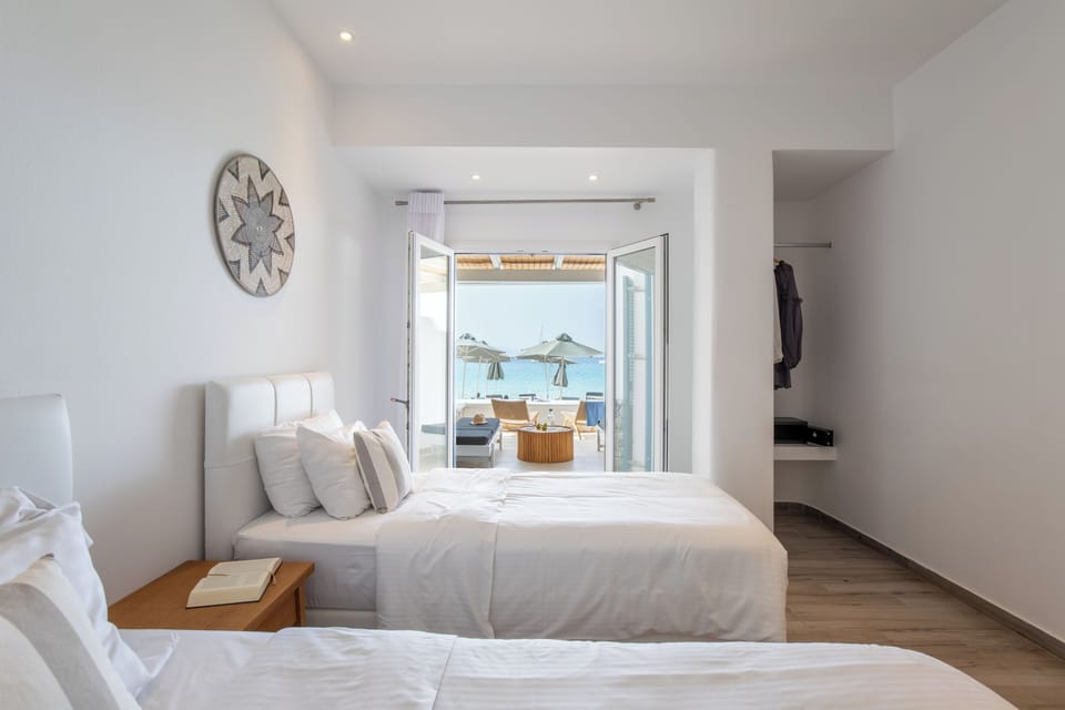 Family Room, 2 Bedrooms, Sea View | Premium bedding, in-room safe, desk, laptop workspace