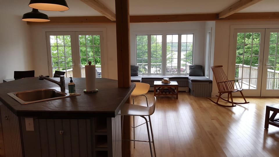 View of kitchen/dining/living area with window seat