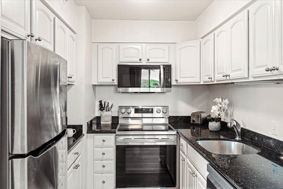 Sleek kitchen with stainless steel appliances