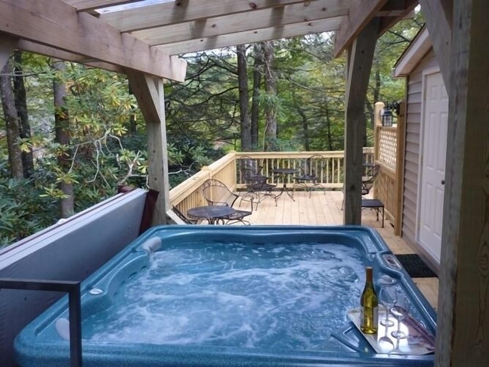 View of hot tub and deck from side gate entrance