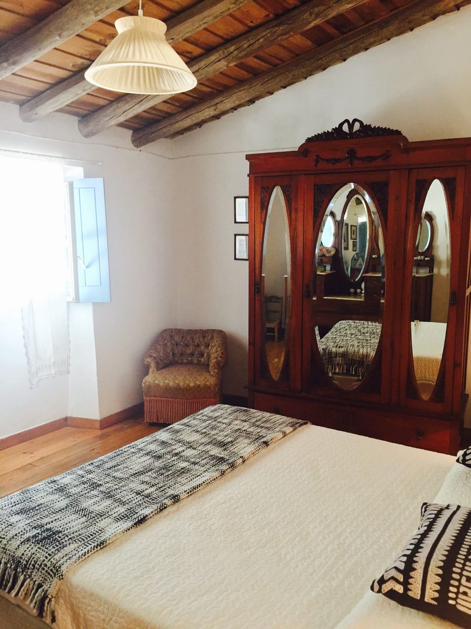 Room 1 has one double bed, a closet and a dresser.