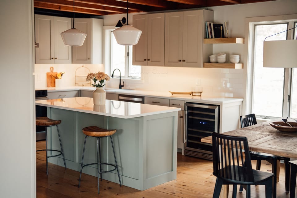 Island with two stools w/ pendant lights, 2 zone wine cooler, floating shelves