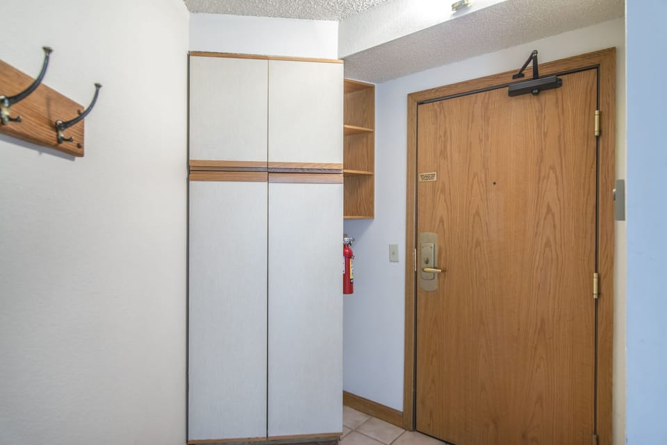 Entry - Offers closet space as well as coat rack.