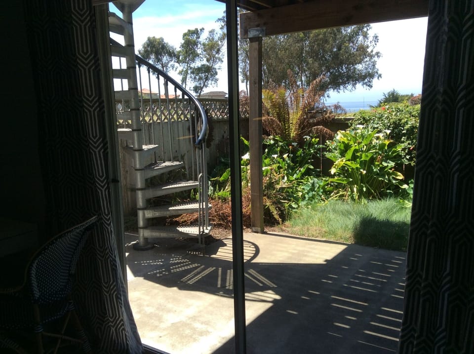 stairs to the upper deck, beautiful garden, and ocean view