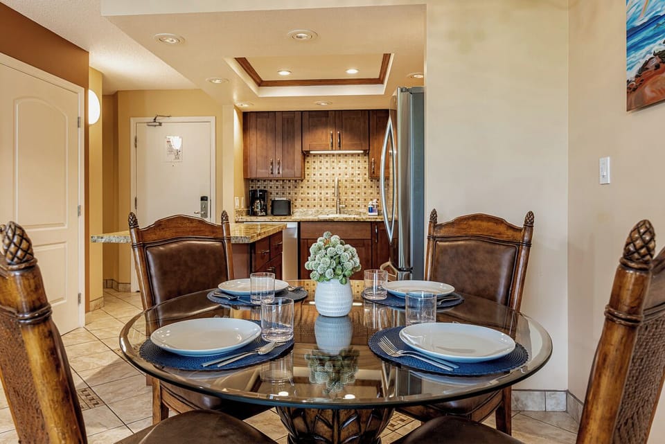 Picture yourself enjoying meals at this elegant dining table, perfectly set for four, with a fully equipped kitchen ready to make your stay feel effortlessly like home.