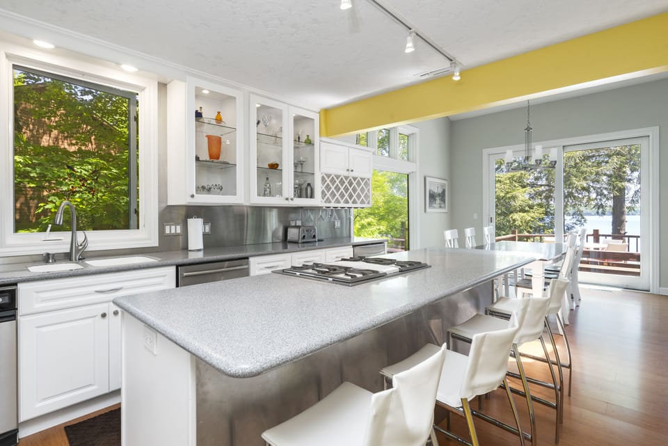Kitchen w/ ample counter space is right off driveway - easy for stocking fridge
