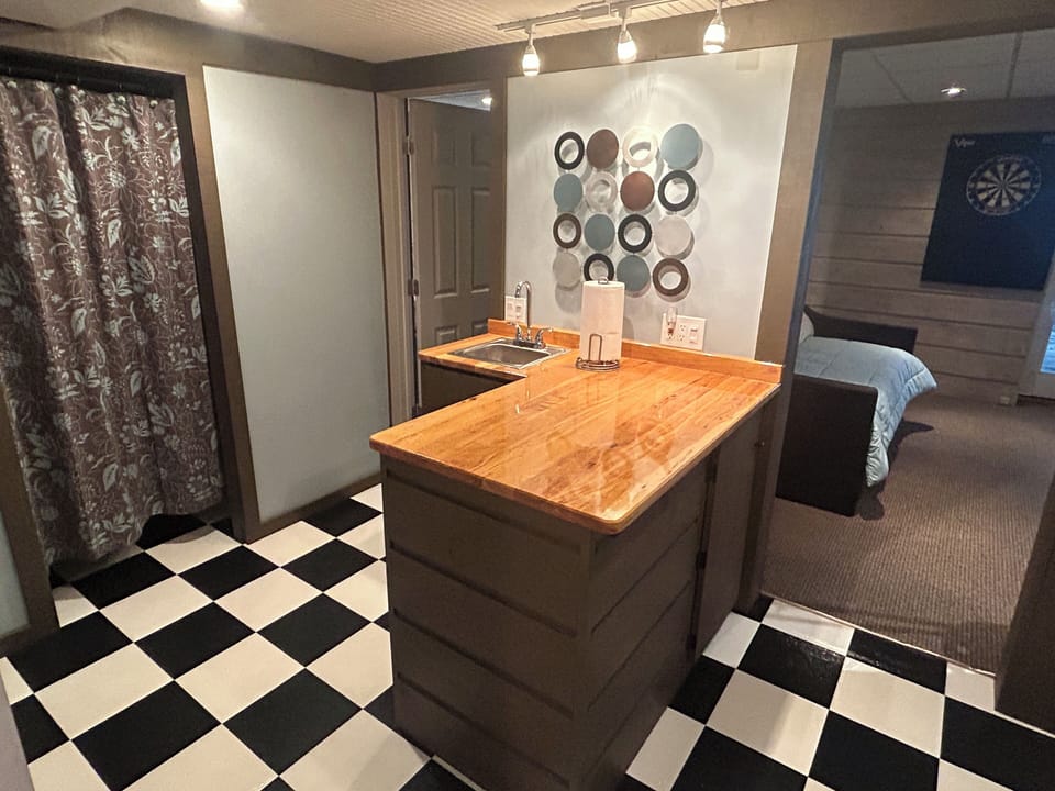 Ample counter space on wet bar provides plenty of room for serving snacks