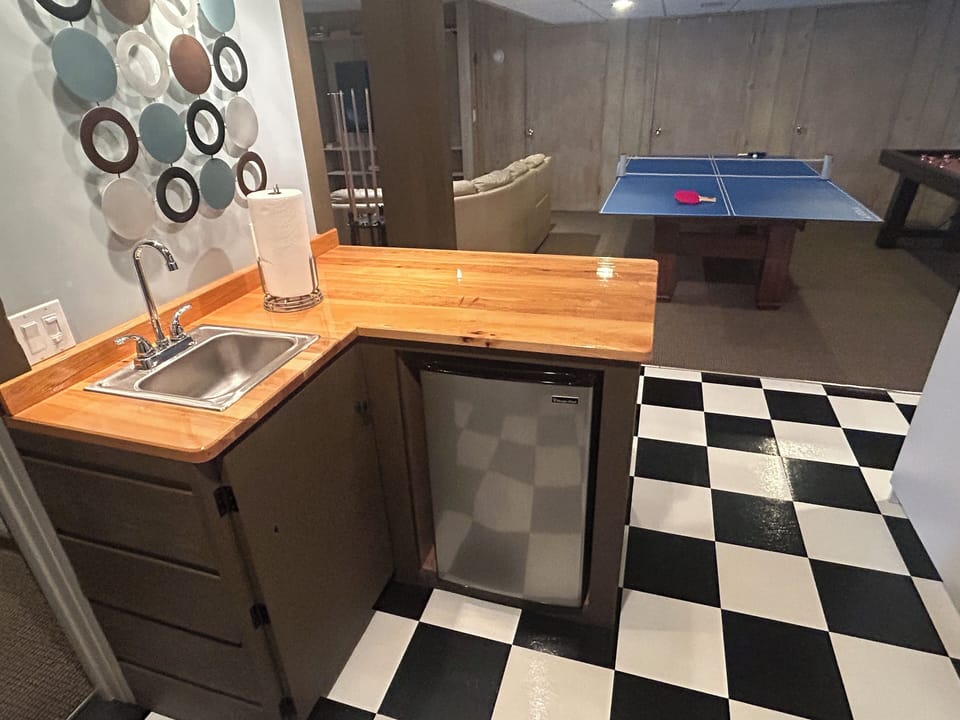 Wet bar and fridge makes serving your favorite beverages easy