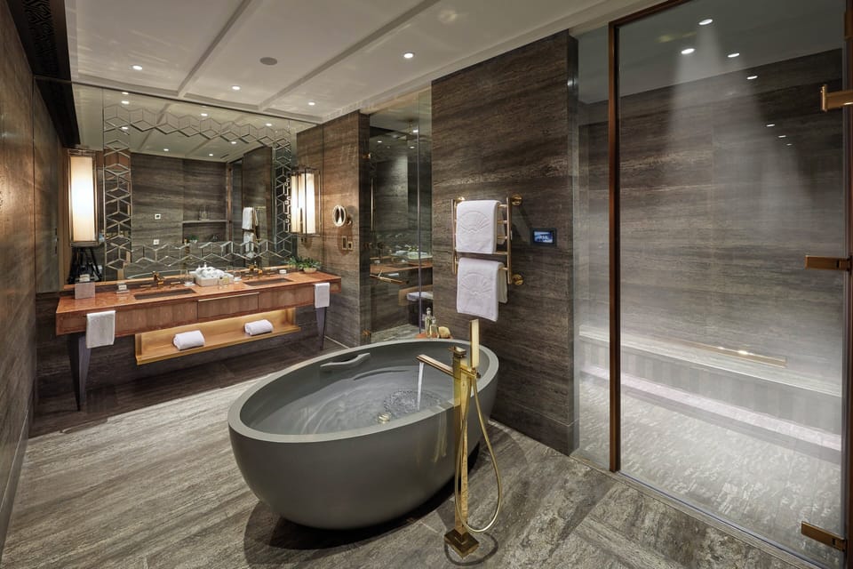Separate tub and shower, designer toiletries, hair dryer, bathrobes
